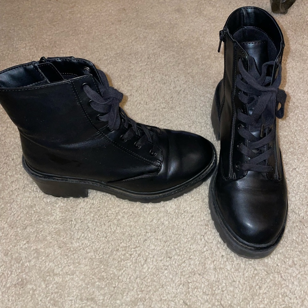 Woman’s black combat boots